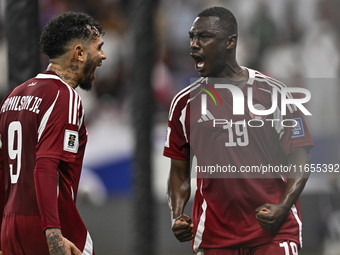 Almoez Ali (R) of Qatar celebrates with Edmilson Junior Dasilva after scoring the opening goal during the FIFA World Cup 2026 AFC Asian Qual...