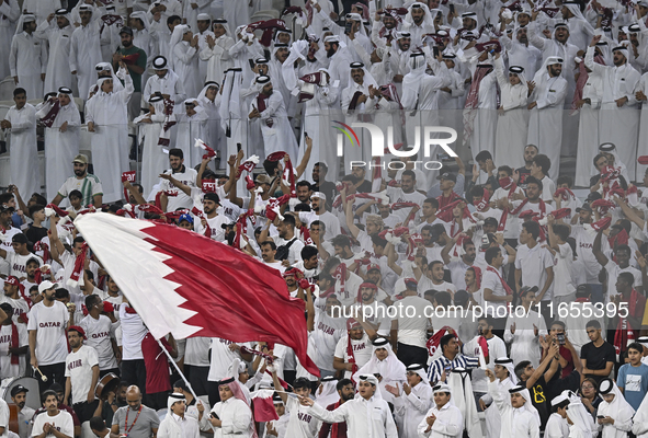 Qatar supporters cheer for their team during the FIFA World Cup 2026 AFC Asian Qualifiers 3rd round group A match between Qatar and Kyrgyzst...