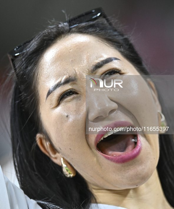 A fan from Kyrgyzstan cheers for their team before the FIFA World Cup 2026 AFC Asian Qualifiers 3rd round group A match between Qatar and Ky...