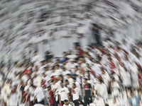 Qatar supporters cheer for their team during the FIFA World Cup 2026 AFC Asian Qualifiers 3rd round group A match between Qatar and Kyrgyzst...