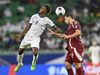 Lucas Mendes of Qatar battles for the ball with Joel Kojo of Kyrgyzstan during the FIFA World Cup 2026 AFC Asian Qualifiers 3rd round group...