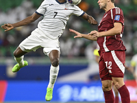 Lucas Mendes of Qatar battles for the ball with Joel Kojo of Kyrgyzstan during the FIFA World Cup 2026 AFC Asian Qualifiers 3rd round group...