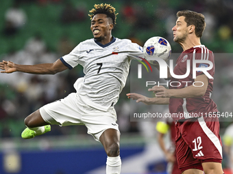 Lucas Mendes of Qatar battles for the ball with Joel Kojo of Kyrgyzstan during the FIFA World Cup 2026 AFC Asian Qualifiers 3rd round group...