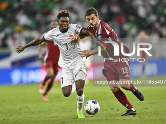 Lucas Mendes of Qatar battles for the ball with Joel Kojo of Kyrgyzstan during the FIFA World Cup 2026 AFC Asian Qualifiers 3rd round group...