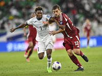 Lucas Mendes of Qatar battles for the ball with Joel Kojo of Kyrgyzstan during the FIFA World Cup 2026 AFC Asian Qualifiers 3rd round group...