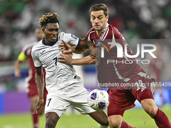 Lucas Mendes of Qatar battles for the ball with Joel Kojo of Kyrgyzstan during the FIFA World Cup 2026 AFC Asian Qualifiers 3rd round group...