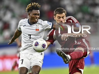 Lucas Mendes of Qatar battles for the ball with Joel Kojo of Kyrgyzstan during the FIFA World Cup 2026 AFC Asian Qualifiers 3rd round group...