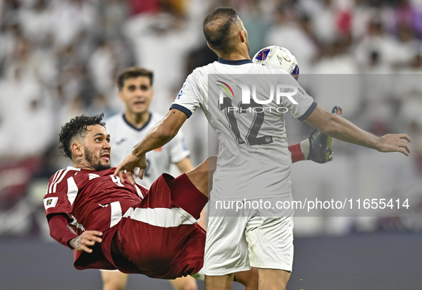 Edmilson Junior Dasilva of Qatar battles for the ball with Abdurakhmanov Odilzhon of Kyrgyzstan during the FIFA World Cup 2026 AFC Asian Qua...