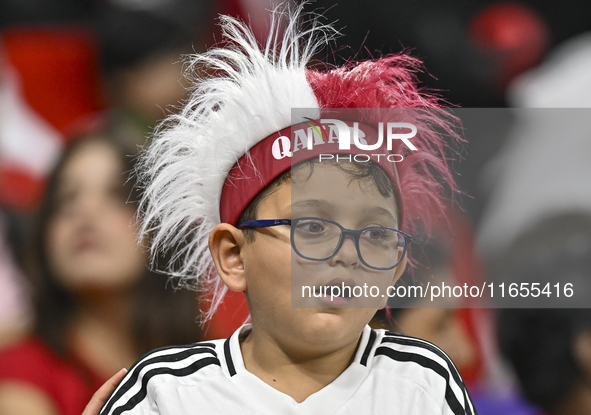 A fan from Qatar cheers for their team before the FIFA World Cup 2026 AFC Asian Qualifiers 3rd round group A match between Qatar and Kyrgyzs...