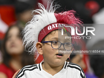 A fan from Qatar cheers for their team before the FIFA World Cup 2026 AFC Asian Qualifiers 3rd round group A match between Qatar and Kyrgyzs...