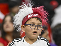 A fan from Qatar cheers for their team before the FIFA World Cup 2026 AFC Asian Qualifiers 3rd round group A match between Qatar and Kyrgyzs...