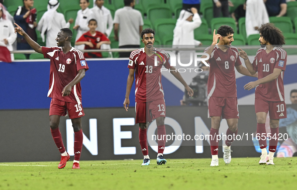 Ibrahim Mohammadali (second from left) of Qatar celebrates with teammates after scoring a goal during the FIFA World Cup 2026 AFC Asian Qual...