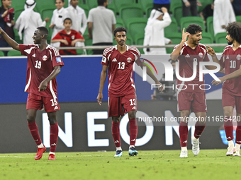 Ibrahim Mohammadali (second from left) of Qatar celebrates with teammates after scoring a goal during the FIFA World Cup 2026 AFC Asian Qual...