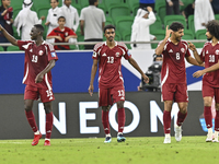 Ibrahim Mohammadali (second from left) of Qatar celebrates with teammates after scoring a goal during the FIFA World Cup 2026 AFC Asian Qual...