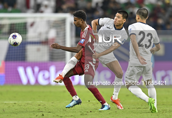 Ibrahim Mohammadali of Qatar battles for the ball with Tamirlan Kozubaev of Kyrgyzstan during the FIFA World Cup 2026 AFC Asian Qualifiers 3...