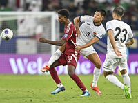 Ibrahim Mohammadali of Qatar battles for the ball with Tamirlan Kozubaev of Kyrgyzstan during the FIFA World Cup 2026 AFC Asian Qualifiers 3...