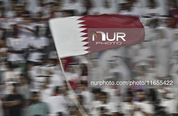 Qatar supporters cheer for their team during the FIFA World Cup 2026 AFC Asian Qualifiers 3rd round group A match between Qatar and Kyrgyzst...