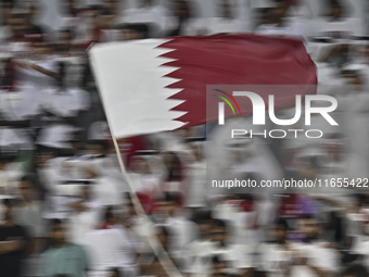 Qatar supporters cheer for their team during the FIFA World Cup 2026 AFC Asian Qualifiers 3rd round group A match between Qatar and Kyrgyzst...