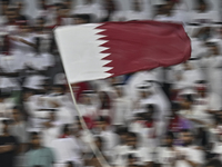 Qatar supporters cheer for their team during the FIFA World Cup 2026 AFC Asian Qualifiers 3rd round group A match between Qatar and Kyrgyzst...