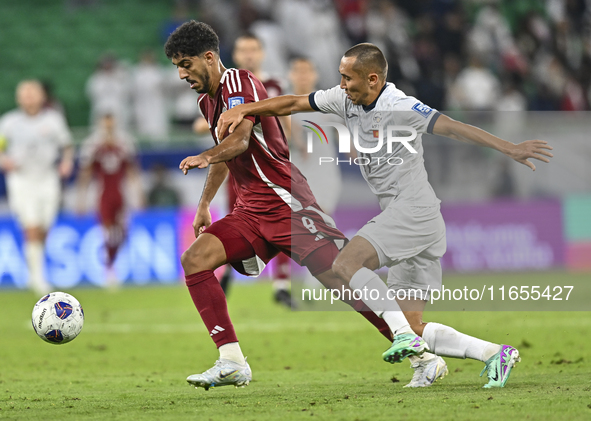 Jassem Gaber Abdulsallam of Qatar battles for the ball with Suiuntbek Mamyraliev of Kyrgyzstan during the FIFA World Cup 2026 AFC Asian Qual...