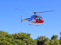 A Heli General Aviation AC311 helicopter performs a sightseeing flight in Yantai, China, on October 1, 2023. The Civil Aviation Administrati...