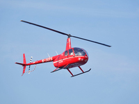 A Tianjin Jinjintong R44 helicopter performs a sightseeing flight in Binhai New Area, Tianjin, China, on October 4, 2023. The Civil Aviation...