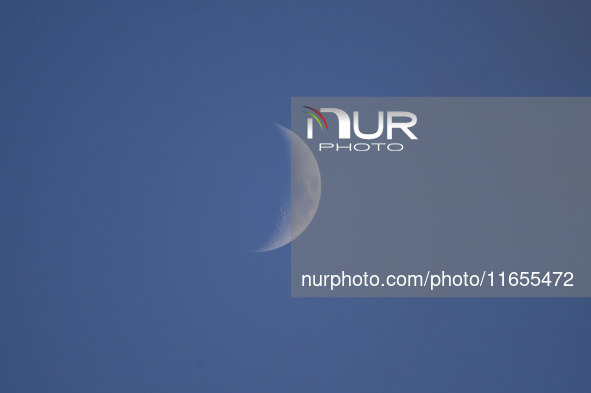 A rising Crescent Moon is seen from Kirtipur, Kathmandu, Nepal, on October 8, 2024. 