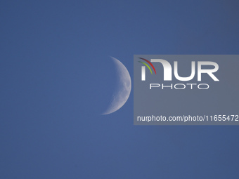 A rising Crescent Moon is seen from Kirtipur, Kathmandu, Nepal, on October 8, 2024. (