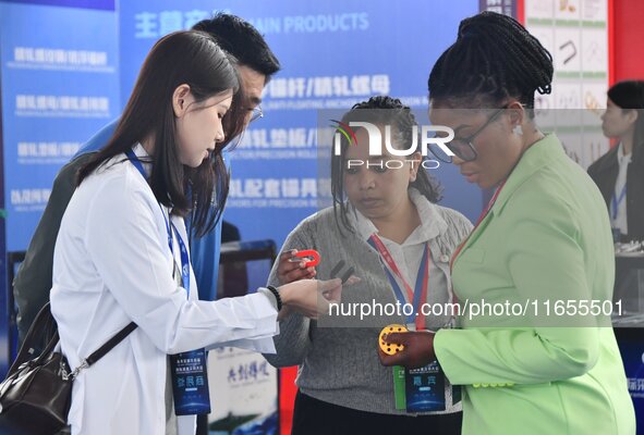 Foreign merchants buy fasteners at the 2024 International Procurement Conference in Handan, China, on October 10, 2024. 