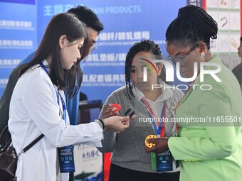 Foreign merchants buy fasteners at the 2024 International Procurement Conference in Handan, China, on October 10, 2024. (