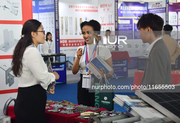 Foreign merchants learn about fastener products at the 2024 International Procurement Conference in Handan, China, on October 10, 2024. 