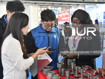 Foreign merchants learn about fastener products at the 2024 International Procurement Conference in Handan, China, on October 10, 2024. (