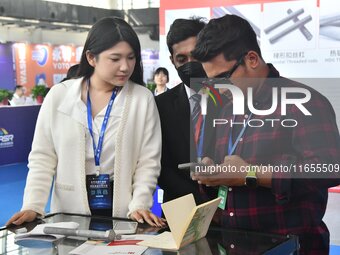 Foreign merchants learn about fastener products at the 2024 International Procurement Conference in Handan, China, on October 10, 2024. (