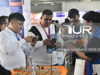 Foreign merchants learn about fastener products at the 2024 International Procurement Conference in Handan, China, on October 10, 2024. (