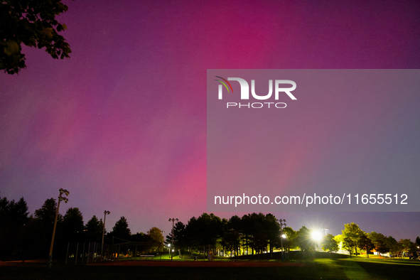 The northern lights (aurora borealis) appear in Toronto, Ontario, Canada, on October 10, 2024. 