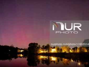 The northern lights (aurora borealis) appear in Toronto, Ontario, Canada, on October 10, 2024. (