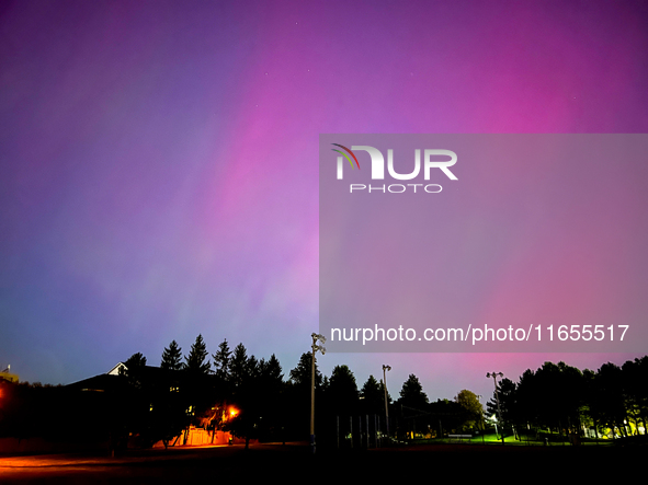 The northern lights (aurora borealis) appear in Toronto, Ontario, Canada, on October 10, 2024. 