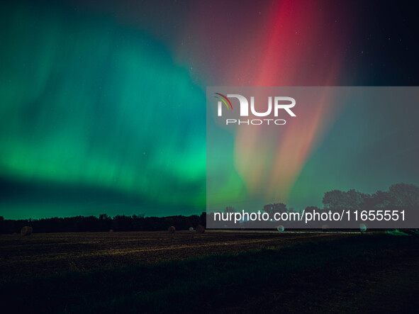 The night sky in Wisconsin glows with the Northern Lights as a geomagnetic storm brings vibrant pink and green colors to a majority of the n...