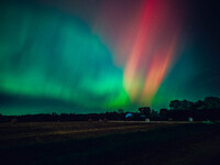 The night sky in Wisconsin glows with the Northern Lights as a geomagnetic storm brings vibrant pink and green colors to a majority of the n...