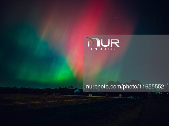 The night sky in Wisconsin glows with the Northern Lights as a geomagnetic storm brings vibrant pink and green colors to a majority of the n...