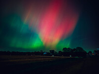 The night sky in Wisconsin glows with the Northern Lights as a geomagnetic storm brings vibrant pink and green colors to a majority of the n...