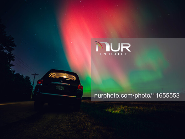 The night sky in Wisconsin glows with the Northern Lights as a geomagnetic storm brings vibrant pink and green colors to a majority of the n...