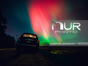 The night sky in Wisconsin glows with the Northern Lights as a geomagnetic storm brings vibrant pink and green colors to a majority of the n...