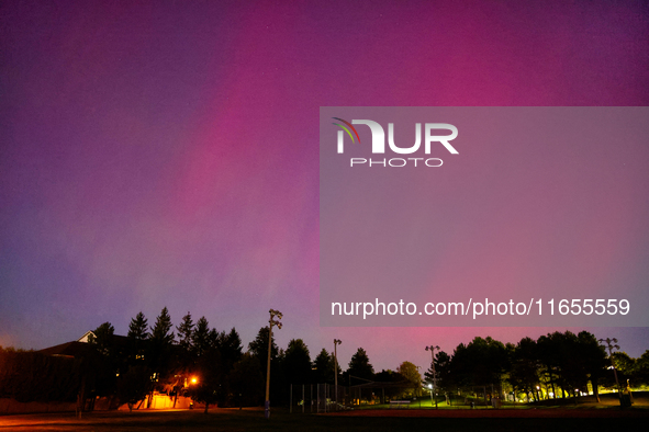 The northern lights (aurora borealis) appear in Toronto, Ontario, Canada, on October 10, 2024. 