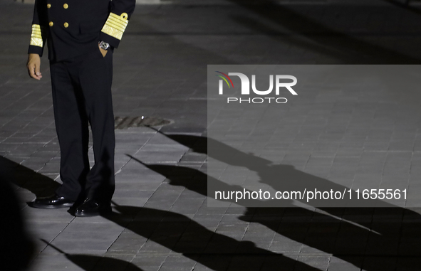 Shadows of cadets appear before the Commemorative Ceremony of the 200th Anniversary of the Mexican Republic in the Zocalo in Mexico City, Me...