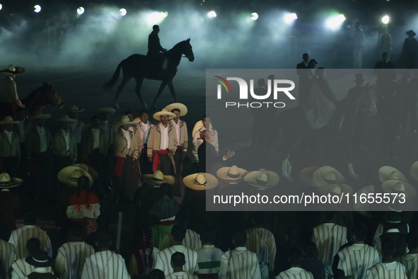 A performance and commemorative ceremony of the 200th anniversary of the Mexican Republic takes place in the Zocalo of Mexico City, Mexico,...