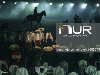 A performance and commemorative ceremony of the 200th anniversary of the Mexican Republic takes place in the Zocalo of Mexico City, Mexico,...