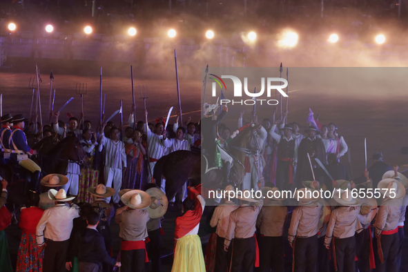 A performance and commemorative ceremony of the 200th anniversary of the Mexican Republic takes place in the Zocalo of Mexico City, Mexico,...