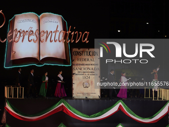 A performance and commemorative ceremony of the 200th anniversary of the Mexican Republic takes place in the Zocalo of Mexico City, Mexico,...