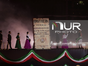 A performance and commemorative ceremony of the 200th anniversary of the Mexican Republic takes place in the Zocalo of Mexico City, Mexico,...